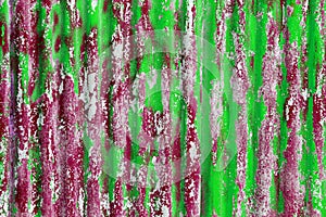 colorful motley peeled off red and green paint layers on corrugated zinc coated steel sheet texture