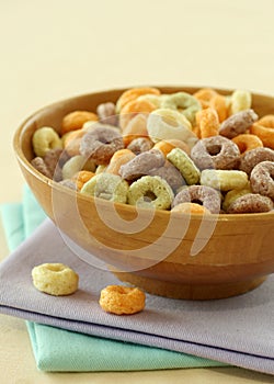 Colorful muesli in wooden bowl