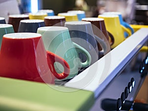 Colorful mugs on Coffee Machine Cafe Restaurant