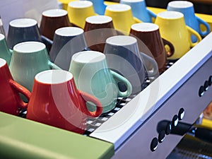 Colorful mugs on Coffee Machine Cafe Restaurant