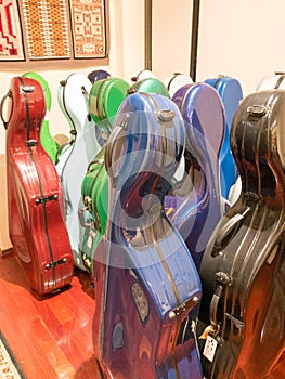 Colorful multicolor Cello Carrying Cases Standing On Display