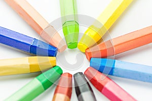 Colorful Multicolored Pastel Wax Crayons Arranged in Circle on White Paper. Back to School Kids Arts Creativity Drawing Hobby