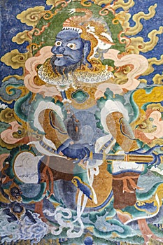 Colorful mural of a Buddhist deity inside of a monastery in Mongar, Bhutan