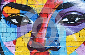 Colorful mural painted on brick graffiti wall, world art day design