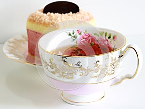 Colorful n yogurt cake and beautiful roses tea cup made with bone chiana