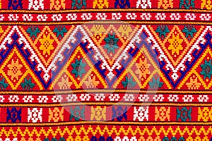 Colorful of native thai style silk and textiles pattern. Beautiful handmade woven fabrics thai silk fabric textured, with