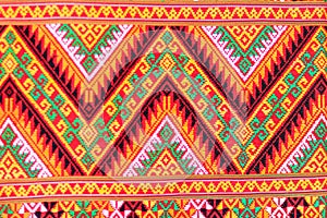Colorful of native thai style silk and textiles pattern. Beautiful handmade woven fabrics thai silk fabric textured, with