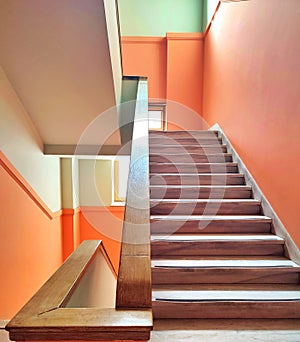 A colorful, naturally lit interior building with stairs.