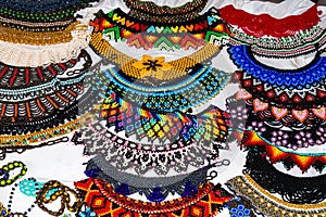 Colorful necklaces and bracelets made of beads photo