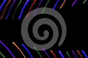 Colorful neon lines on black background. Rainbow lines texture. Neon glowing curves.