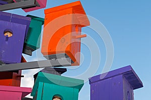 Colorful nesting boxes on blue sky