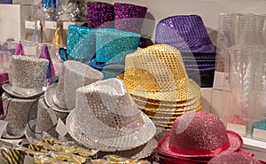 Colorful new years eve party hats for sale in a shop glitter shiny colorful