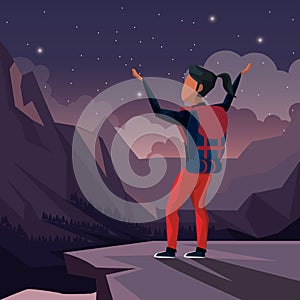 Colorful night landscape of climber woman celebrating at the top of mountain