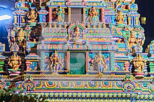 Colorful night view of indian gods sculpture at Sri Maha Mariamman Temple, also known as Maha Uma Devi temple, the public hindu t photo