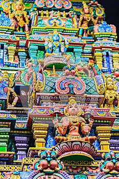 Colorful night view of indian gods sculpture at Sri Maha Mariamman Temple, also known as Maha Uma Devi temple, the public hindu t