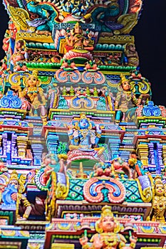 Colorful night view of indian gods sculpture at Sri Maha Mariamman Temple, also known as Maha Uma Devi temple, the public hindu t