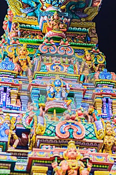 Colorful night view of indian gods sculpture at Sri Maha Mariamman Temple, also known as Maha Uma Devi temple, the public hindu t