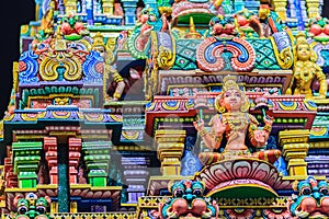 Colorful night view of indian gods sculpture at Sri Maha Mariamman Temple, also known as Maha Uma Devi temple, the public hindu t