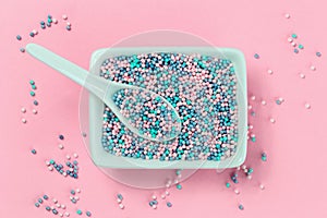 Colorful nonpareils cake sprinkles in rectangular bowls