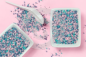 Colorful nonpareils cake sprinkles in rectangular bowls