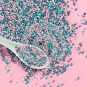 Colorful nonpareils cake sprinkles with spoon