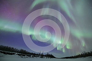 Colorful Northern lights are dancing in the sky