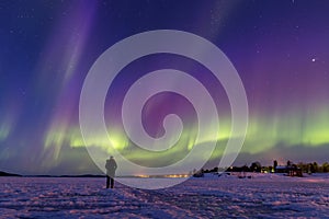 Colorful northern lights over lake Inari, Finland