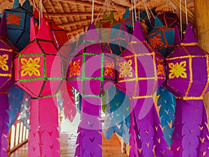 Colorful Northern of Thailand lamps hanging in bamboo hut. Handmade lamp made from paper. The symbol of festival of native people