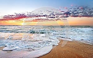 Colorful ocean beach sunrise.