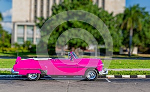 Colorful, old, antique, made over vehicle resembling 1950 American car in Havana, Cuba