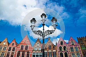 Colorful old brick houses in the Market Square in Old Town of Bruges, Belgium