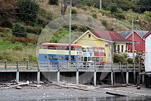 Colorful old Double Decker buses and buildings Alert Bay, BC