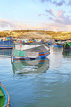 Colorful old fishing boats at Marsaxlokk village Malta