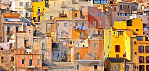 The colorful old houses with windows in city of Sciacca overlooking its harbour. Province of Agrigento, Sicily.