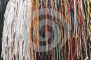 Colorful old Shoelaces or shoestrings hanging in front of shop