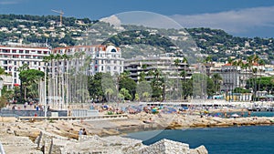 Colorful old town and beach in Cannes timelapse on french Riviera in a beautiful summer day, France