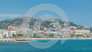 Colorful old town and beach in Cannes timelapse on french Riviera in a beautiful summer day, France