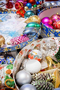 Colorful open round boxes with all sorts of bright Christmas decorations.