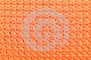 Colorful orange crochet knitted patterns texture for background