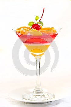 Colorful orange jelly - Fruit jelly in cocktail glass photo