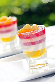 Colorful orange jelly - Fruit jelly in shot Glass photo