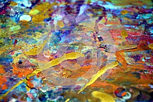 Colorful orange yellow purple gold paint splashes, colorful vivid waxy colors, contrasts creative background