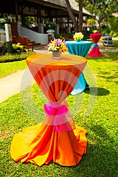 Colorful orchid decor on India wedding dinner