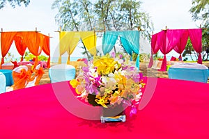 Colorful orchid decor on India wedding dinner