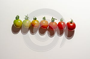 Colorful organic cherry tomatoes on a white background. Diet or healthy food concept