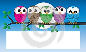 Colorful owls sitting on a branch