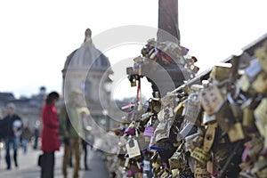 Colorful padlocks on Pont des Arts in Paris, France.