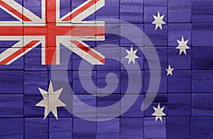 colorful painted big national flag of australia on a wooden cubes texture