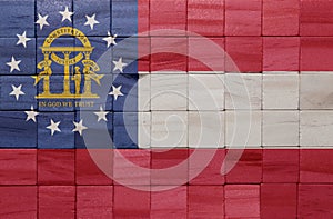 colorful painted big national flag of georgia state on a wooden cubes texture