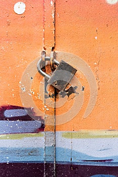 Colorful painted door and padlock